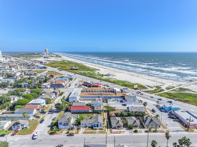 drone / aerial view with a water view and a view of the beach