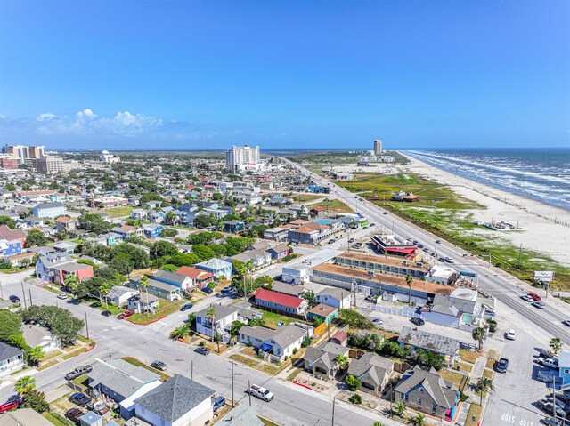 birds eye view of property featuring a water view and a view of the beach