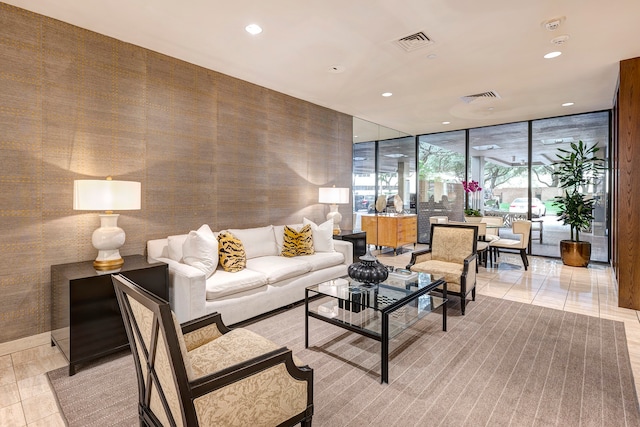 living room featuring floor to ceiling windows