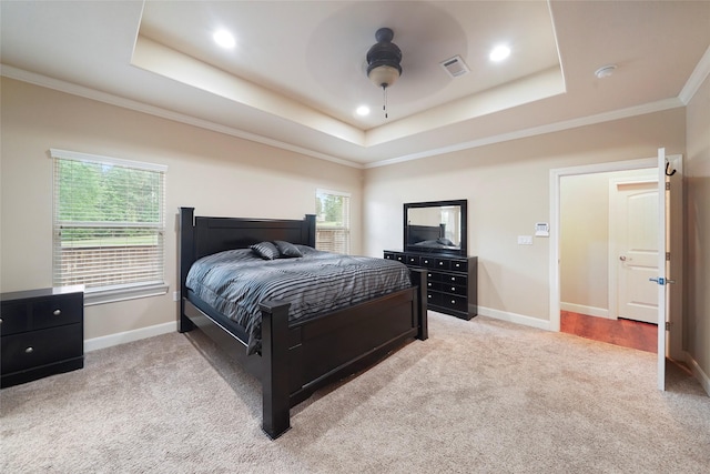 bedroom with ceiling fan, light carpet, and multiple windows