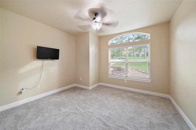 spare room with carpet flooring and ceiling fan