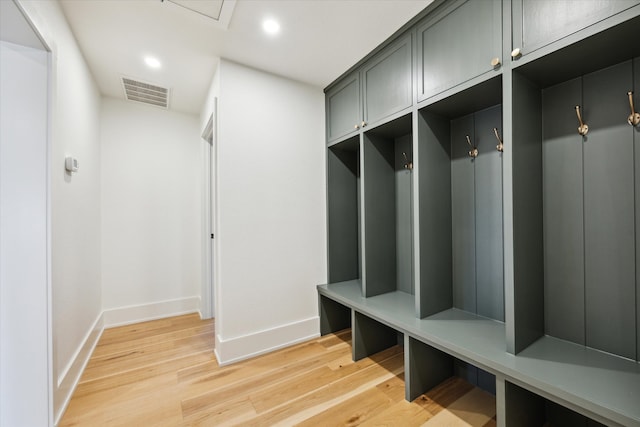 mudroom with light hardwood / wood-style floors