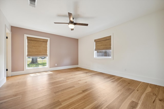 empty room with light hardwood / wood-style flooring and ceiling fan