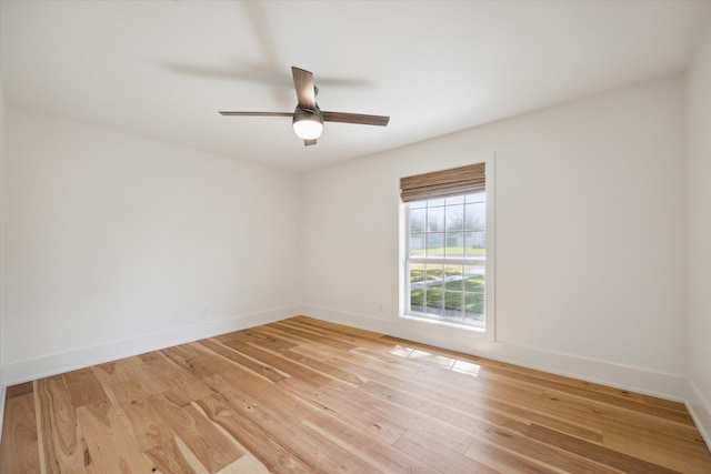 unfurnished room featuring ceiling fan and light wood-type flooring