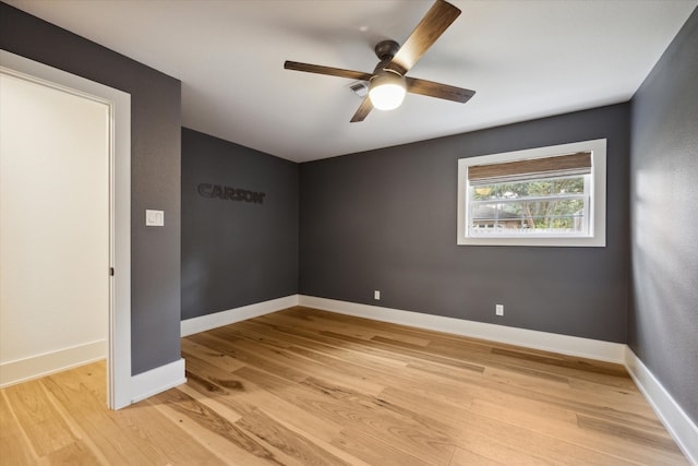 spare room with ceiling fan and light hardwood / wood-style flooring