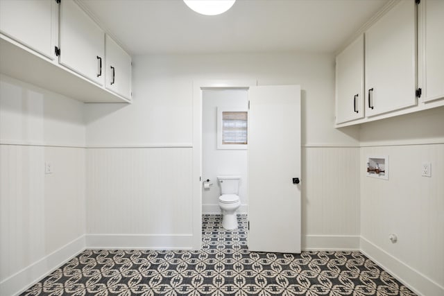 laundry area featuring hookup for a washing machine and cabinets