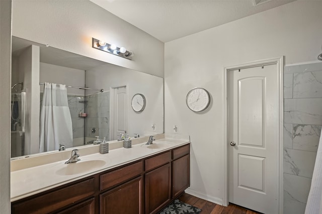 bathroom with vanity, shower / bathtub combination with curtain, and hardwood / wood-style flooring