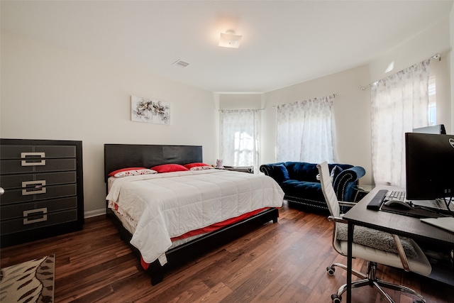 bedroom featuring dark hardwood / wood-style flooring