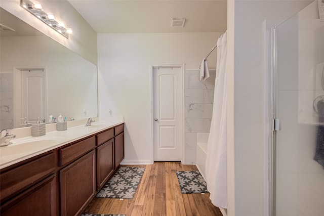 bathroom with hardwood / wood-style floors and vanity