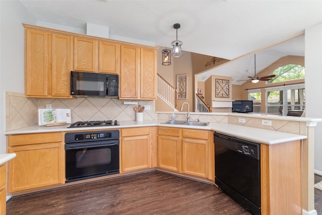 kitchen featuring sink, tasteful backsplash, kitchen peninsula, vaulted ceiling, and black appliances