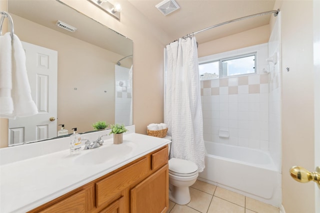 full bathroom featuring tile patterned floors, vanity, toilet, and shower / tub combo