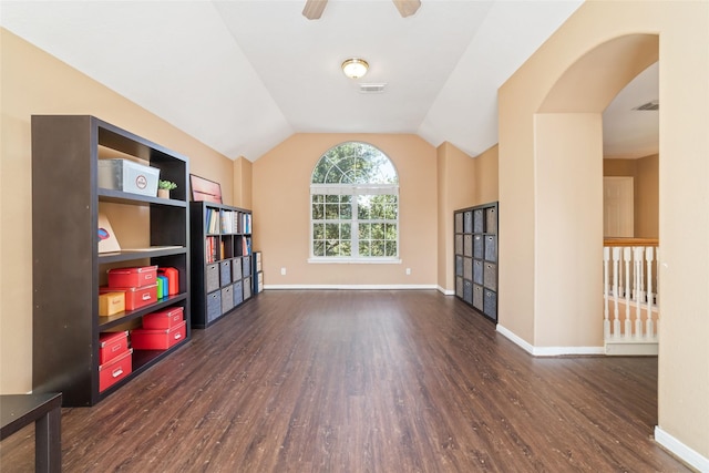 unfurnished room featuring ceiling fan, dark wood-type flooring, and vaulted ceiling