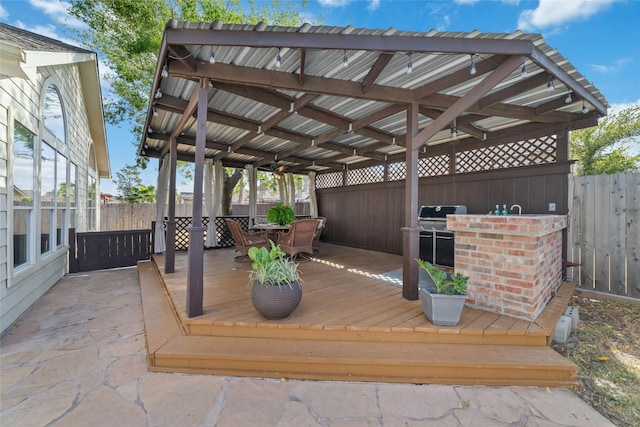 deck featuring area for grilling and a patio area