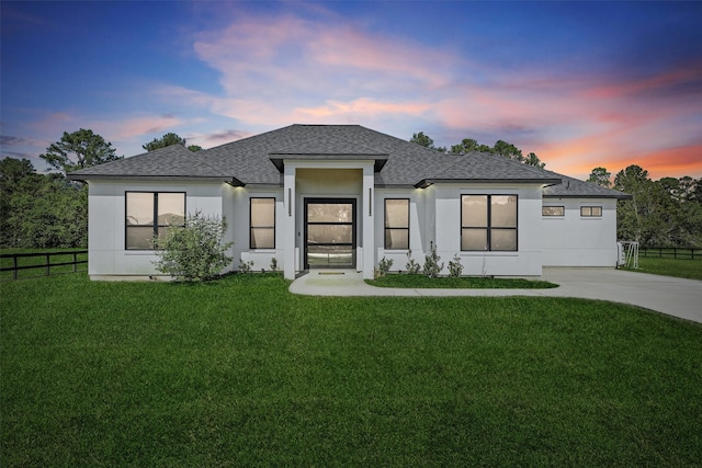 view of front of house with a yard