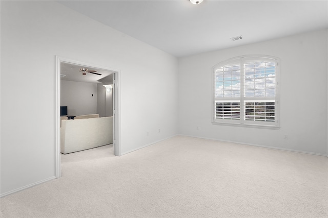 unfurnished bedroom featuring light carpet