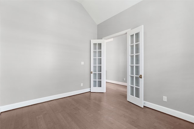 unfurnished room with french doors, high vaulted ceiling, and wood-type flooring