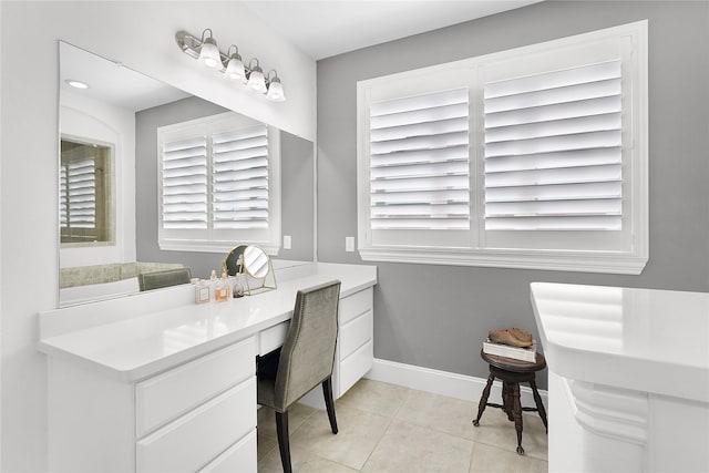 office featuring built in desk and light tile patterned floors