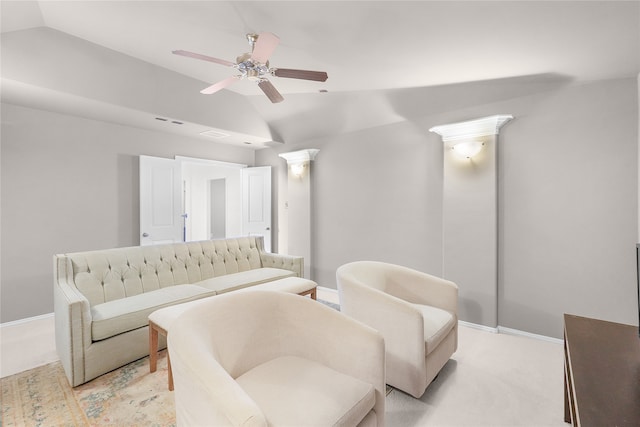 living room with lofted ceiling, light carpet, and ceiling fan