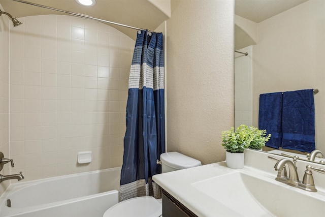 full bathroom featuring shower / bath combo, vanity, and toilet