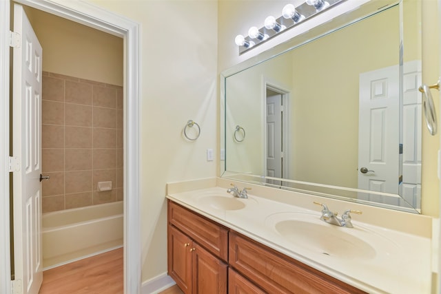 bathroom with hardwood / wood-style floors and vanity