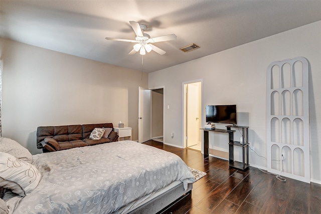 bedroom with dark wood-type flooring and ceiling fan