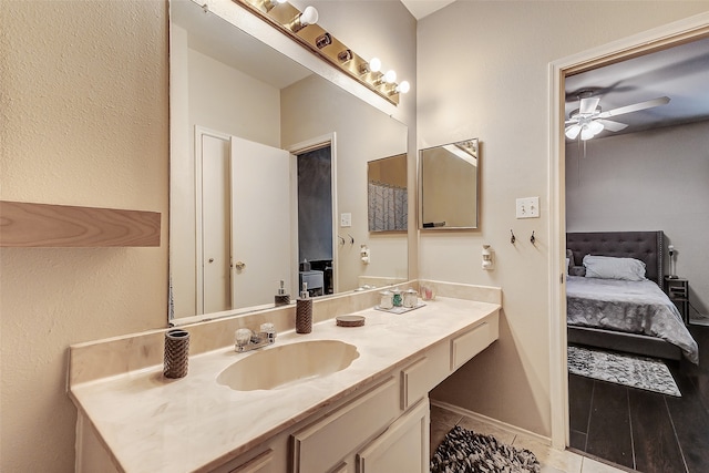 bathroom featuring vanity, tile patterned floors, and ceiling fan