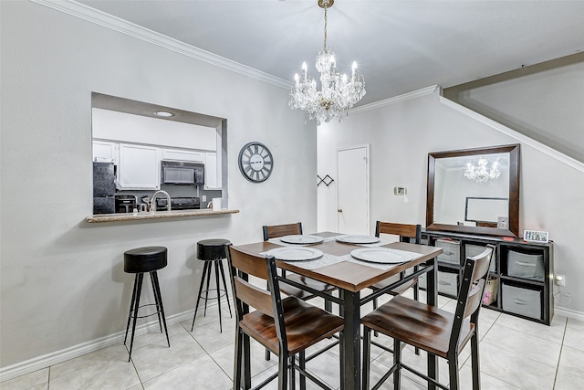 dining area featuring an inviting chandelier, ornamental molding, sink, and light tile patterned floors