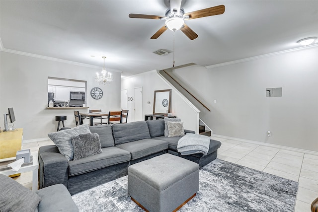 tiled living room with crown molding and ceiling fan with notable chandelier