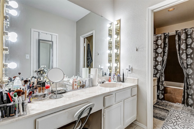 bathroom with vanity, tile patterned floors, and shower / tub combo