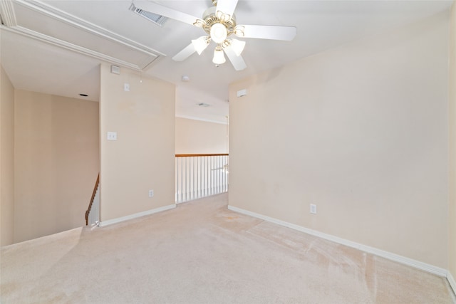 carpeted empty room featuring ceiling fan