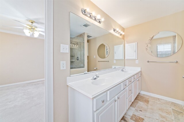 bathroom featuring vanity, a tile shower, and ceiling fan