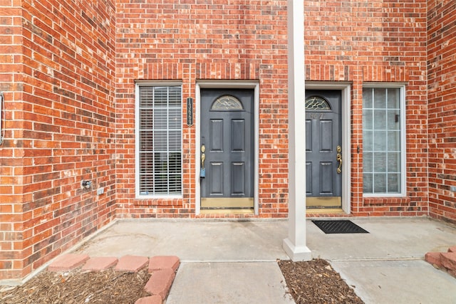 property entrance featuring a patio