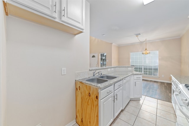 kitchen featuring white appliances, pendant lighting, white cabinets, ornamental molding, and light tile patterned floors