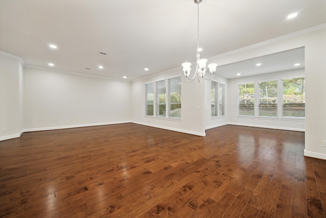 interior space featuring dark wood-type flooring, crown molding, and an inviting chandelier