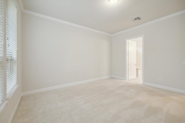 carpeted spare room with crown molding