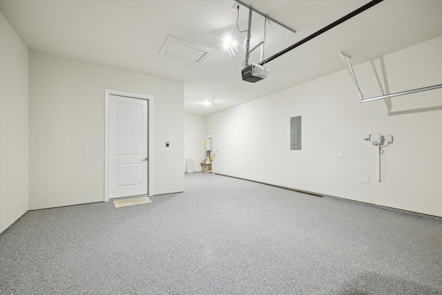 garage featuring electric panel and a garage door opener