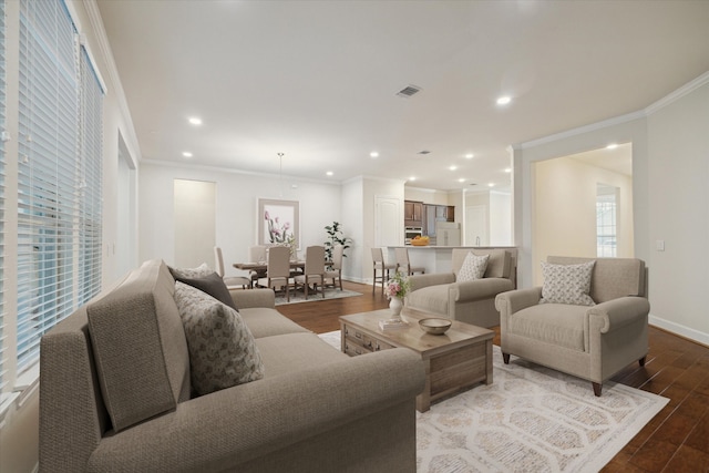 living room with hardwood / wood-style floors and ornamental molding