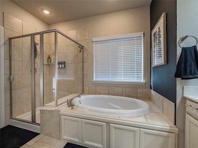 bathroom with vanity, independent shower and bath, and tile patterned floors