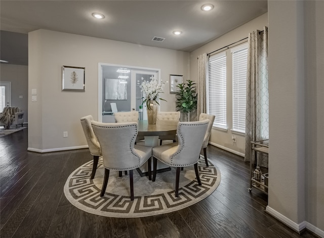 dining space featuring dark hardwood / wood-style flooring