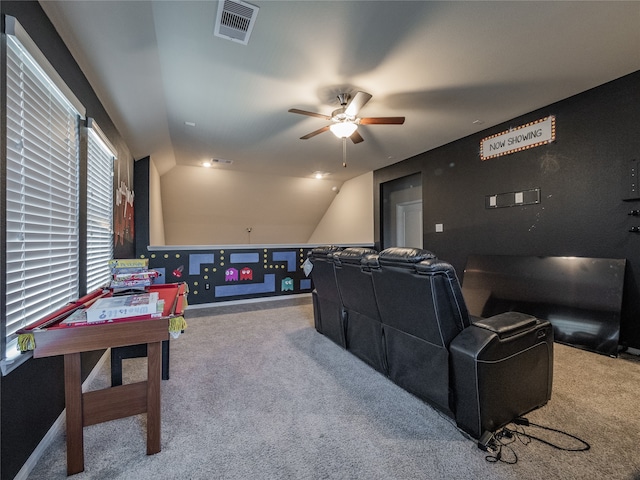 cinema room with carpet, vaulted ceiling, and ceiling fan