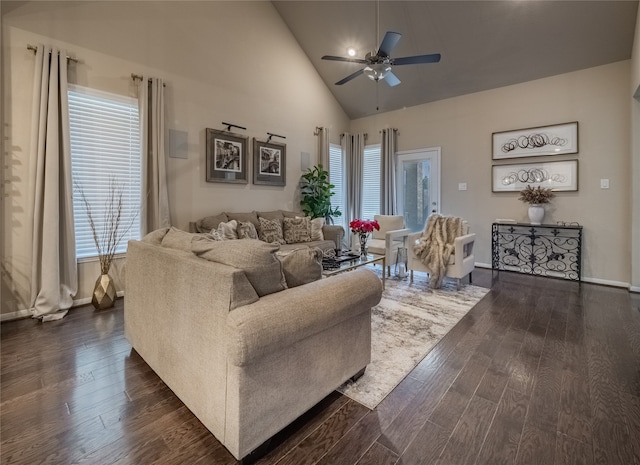 living room with ceiling fan, high vaulted ceiling, dark hardwood / wood-style flooring, and plenty of natural light