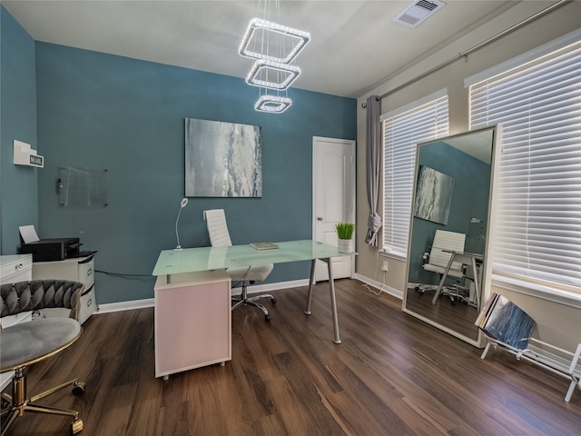 office featuring dark wood-type flooring and an inviting chandelier