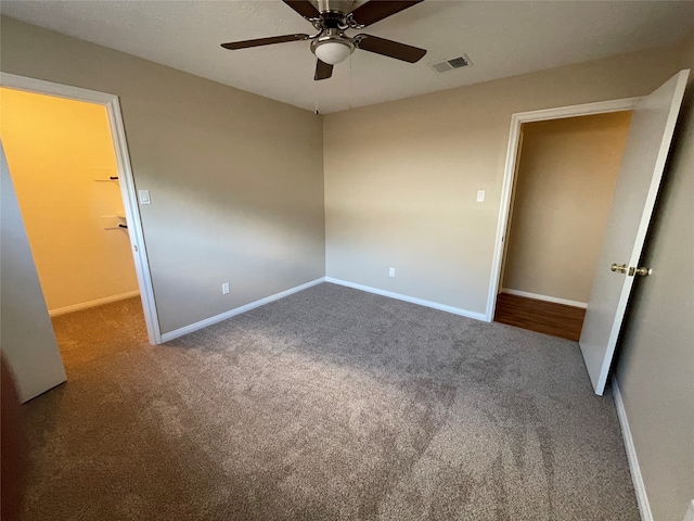 unfurnished bedroom with carpet flooring and ceiling fan