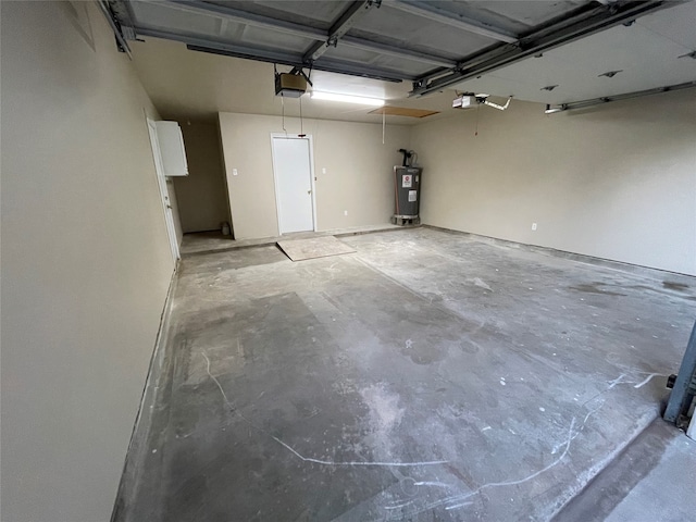 garage with a garage door opener and water heater