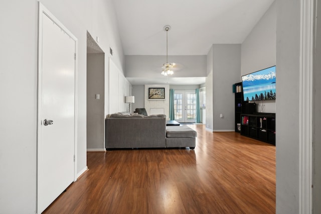 living room featuring french doors, dark hardwood / wood-style floors, and ceiling fan