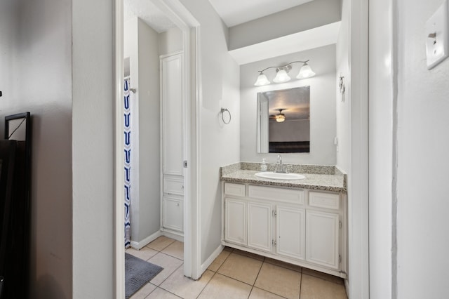 bathroom with vanity and tile patterned flooring