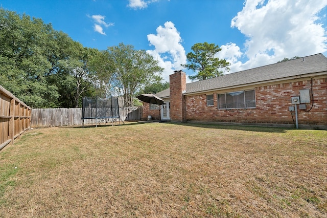 view of yard with a trampoline