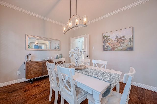 dining room with crown molding, dark hardwood / wood-style flooring, and a chandelier