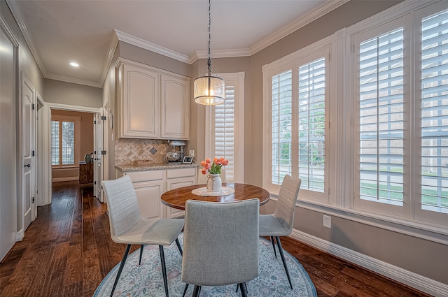 dining area with ornamental molding, dark wood-type flooring, and plenty of natural light