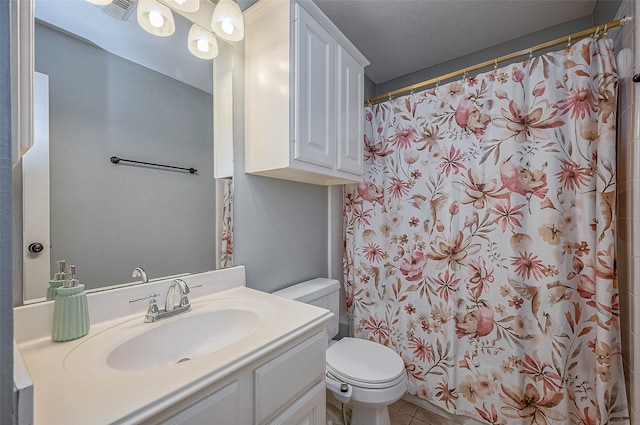 bathroom featuring a textured ceiling, toilet, vanity, a shower with shower curtain, and tile patterned flooring